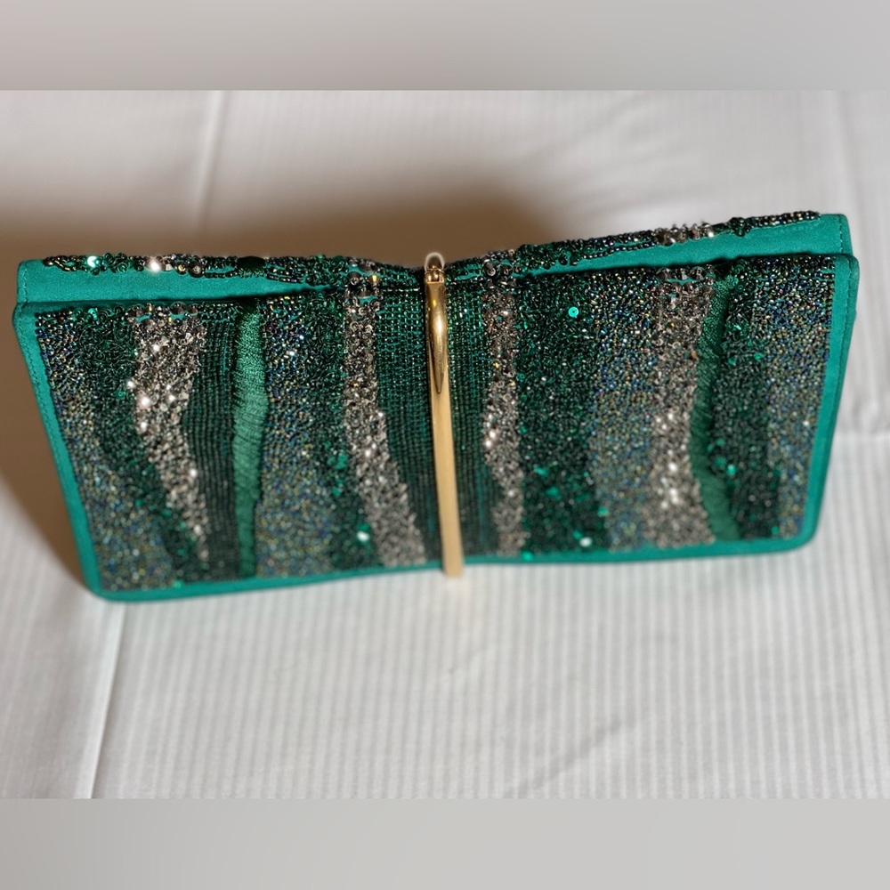 Gorgeous Authentic Nina Ricci green Crystal Effect Arc Clutch
